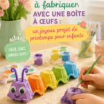 Un enfant souriant en train de décorer des boîtes d'œufs pour un projet de bricolage printanier.