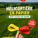 Hélicoptère en papier fabriqué à la main, suspendu dans les airs.